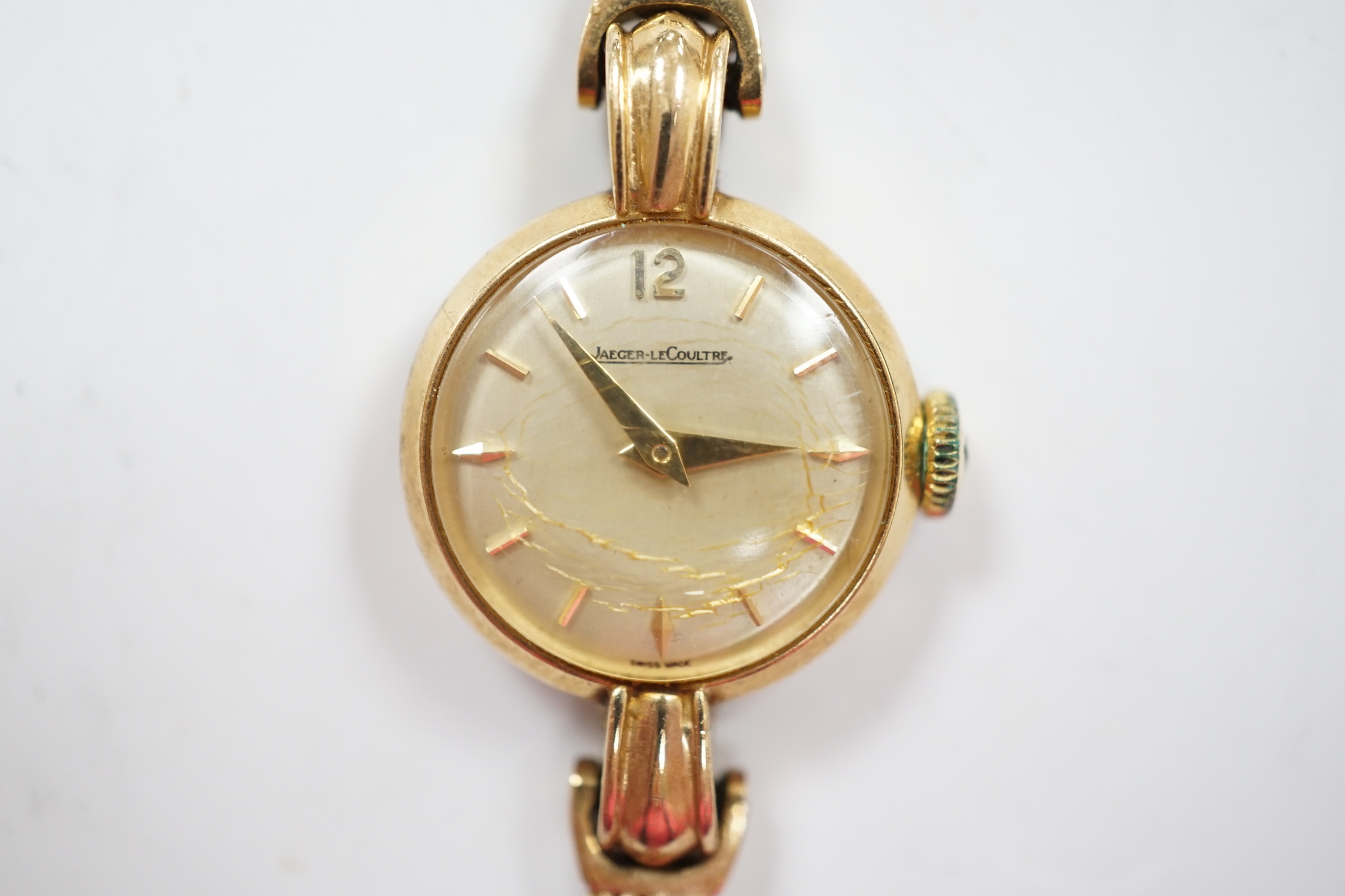 A lady's 9ct gold Jaeger LeCoultre manual wind wrist watch, on an associated 9ct gold bracelet, overall 16.8cm, gross weight 20.4 grams.